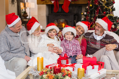 Multi generation family sitting on a couch during christmas