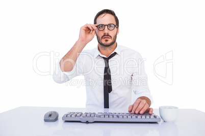 Business worker with reading glasses on computer