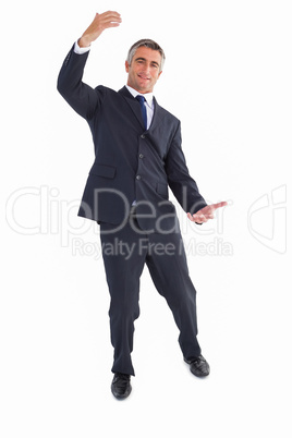 Happy businessman well dressed with arms out