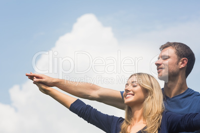 Cute couple smiling together on sunny day