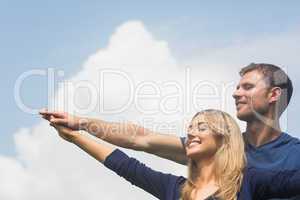 Cute couple smiling together on sunny day