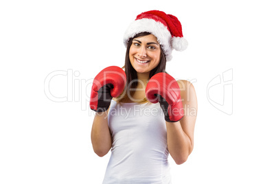 Festive brunette in boxing gloves