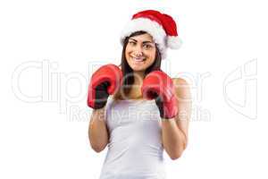 Festive brunette in boxing gloves