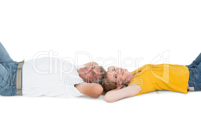 Casual couple lying on floor