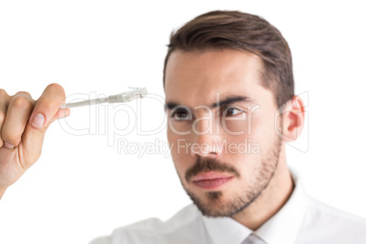 Focused businessman holding white cable
