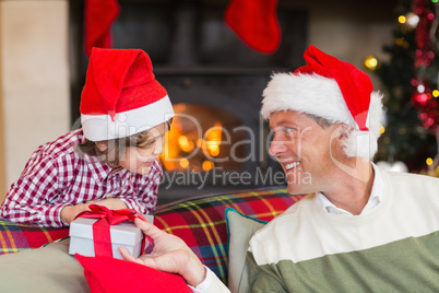 Father giving his son a christmas present