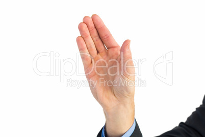 Businessman holding hand out in presentation