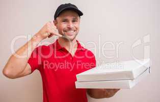 Pizza delivery man making phone call gesture