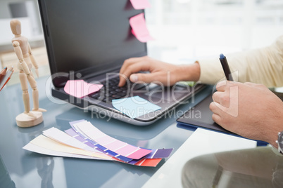 Designer using laptop and digitizer