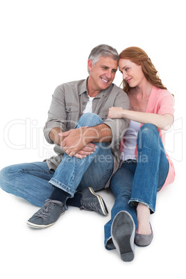 Casual couple sitting and smiling