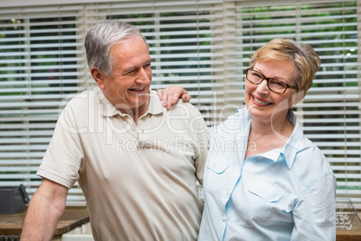 Senior couple hugging and smiling