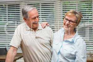 Senior couple hugging and smiling