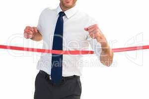 Businessman crossing the finish line