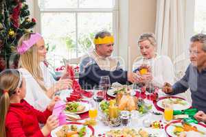 Family in party hat having fun at christmas time