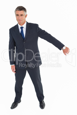 Smiling businessman showing his wrist time