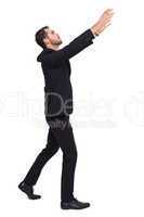 Businessman with arms raised catching something