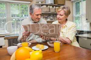Senior couple having breakfast together