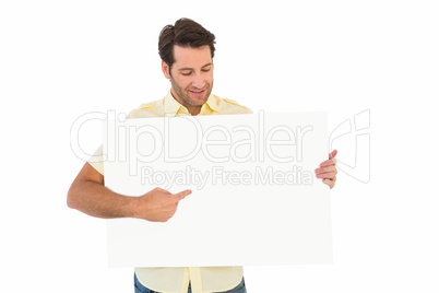 Attractive man smiling and pointing white poster