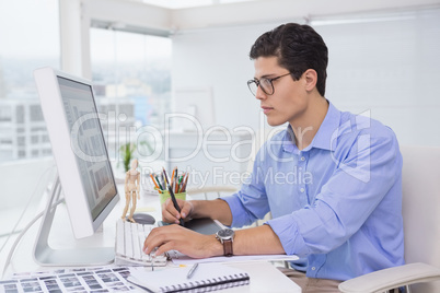 Photo editor working at his desk