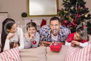 Happy family leaning on the couch