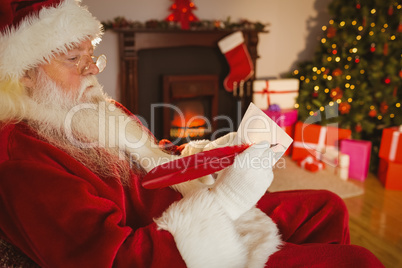 Santa claus writing list on scroll