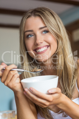 Cute blonde having cereal for breakfast Cute blonde having cereal for breakfast