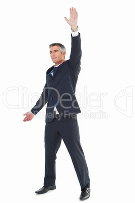 Smiling businessman doing a gesture