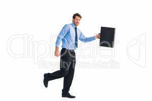 Walking and smiling businessman with suitcase