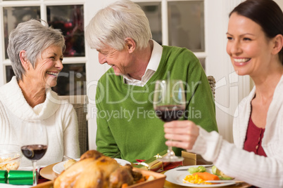 Senior couple laughing at christmas dinner