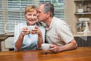 Senior couple having coffee together