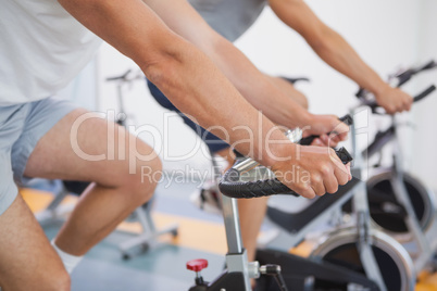 Fit people working out on the exercise bikes