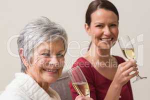 Smiling women holding glass of champagne