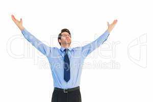 Cheering businessman with his arms raised up