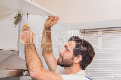 Handyman putting up a shelf
