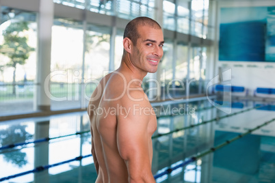 Fit swimmer by the pool at leisure center