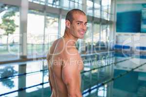 Fit swimmer by the pool at leisure center