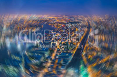 London at night. Blurred aerial view of Tower Bridge area and ci