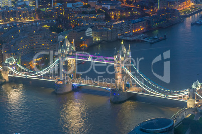 London at night. Aerial view of Tower Bridge area and city light
