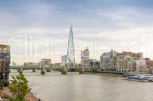 London skyline and Thames river on a cloudy day
