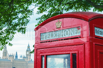 Traditional telephone booth along river Thames, Westminster Pala
