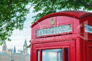 Traditional telephone booth along river Thames, Westminster Pala