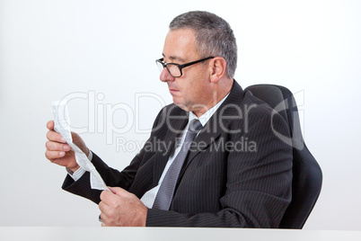Man reading instruction manual on the desk