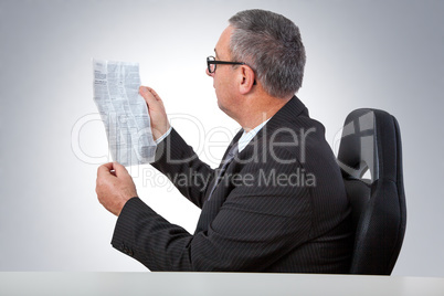 Man reading instruction manual on the desk