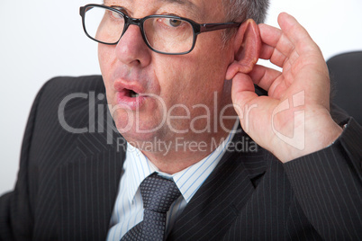 Man holding ear to listen
