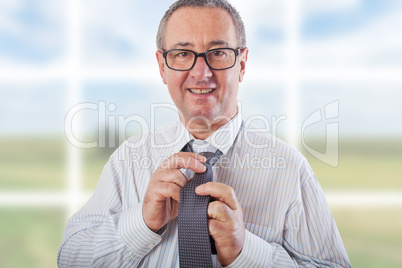 Businessman binds the tie