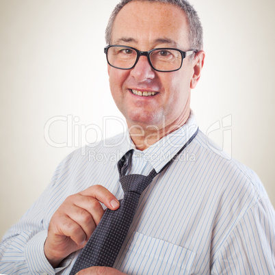 Businessman binds the tie