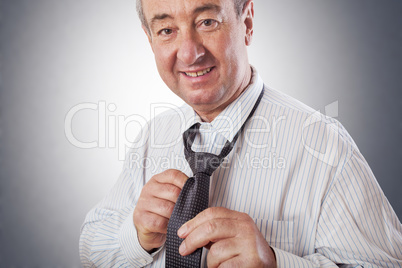 Businessman binds the tie