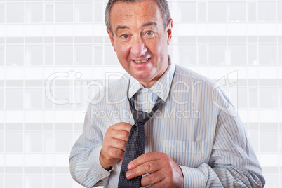 Businessman binds the tie