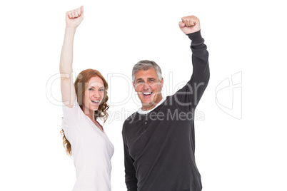 Casual couple cheering at camera