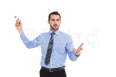 Businessman speaking and gesturing with marker